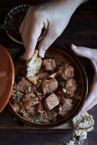 Midsection of person preparing food on table