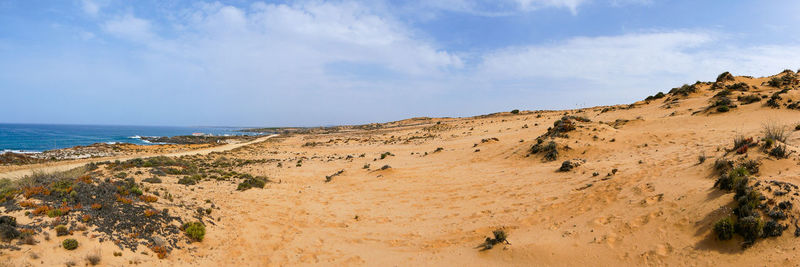 Panoramic view of beach against sky