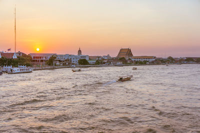 View of buildings against sky during sunset