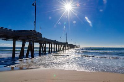 Pier over sea against sky