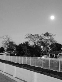 View of illuminated street lights against clear sky