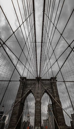 Low angle view of brooklyn bridge against sky