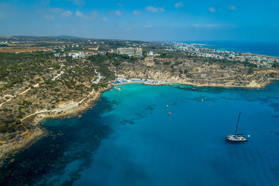 High angle view of sailboats in sea against sky