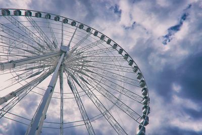 Low angle view of ferris wheel against sky