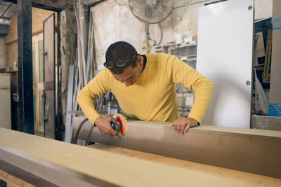 Carpenter working in workshop