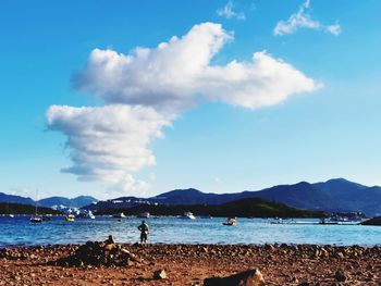 Scenic view of sea against blue sky