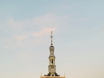 Low angle view of bell tower against sky