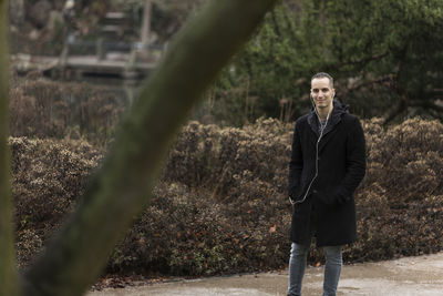 Portrait of man standing on land