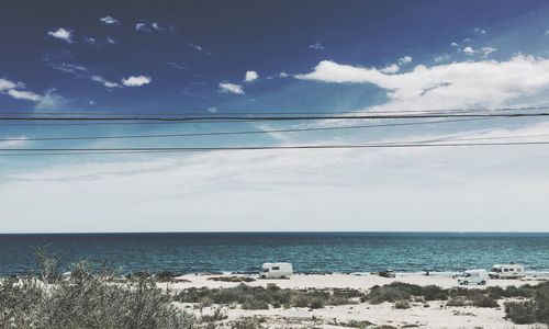 Scenic view of sea against cloudy sky