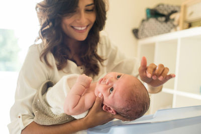 Portrait of mother and daughter at home