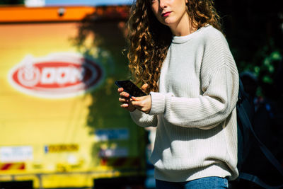 Young woman using mobile phone