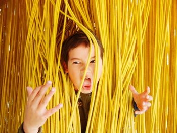 Close-up of boy playing with fabric