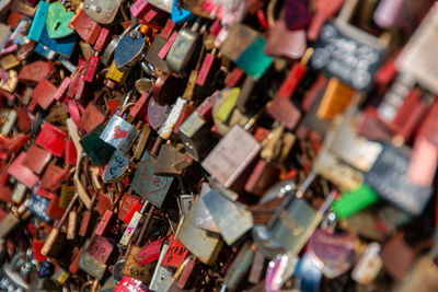 Close-up of padlocks hanging on railing