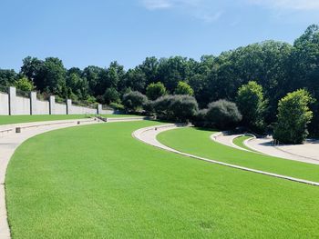 Scenic view of golf course against sky