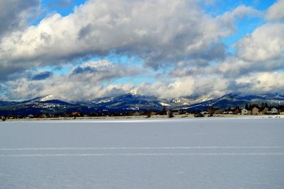 Scenic view of mountains against sky during winter