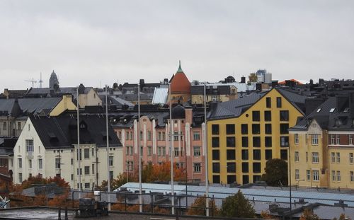 Buildings in city against sky