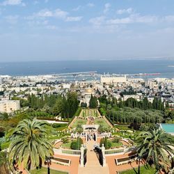 High angle view of beach and city against sky