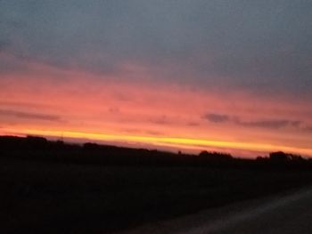 Scenic view of dramatic sky during sunset