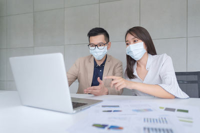 People working on laptop