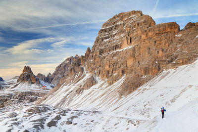 Scenic view of rocky mountains against sky during winter