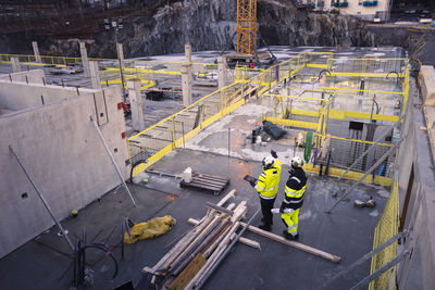 Two engineers working at construction site