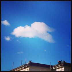 High section of built structure against blue sky