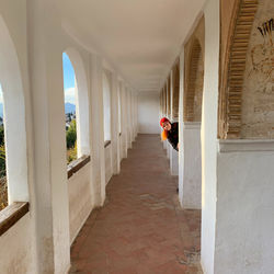 Rear view of person on corridor of building