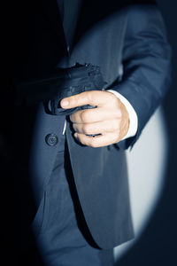 Midsection of businessman holding hands