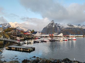 Scenic view of sea and mountains against sky