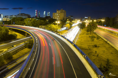 High angle view of light trails on road at night