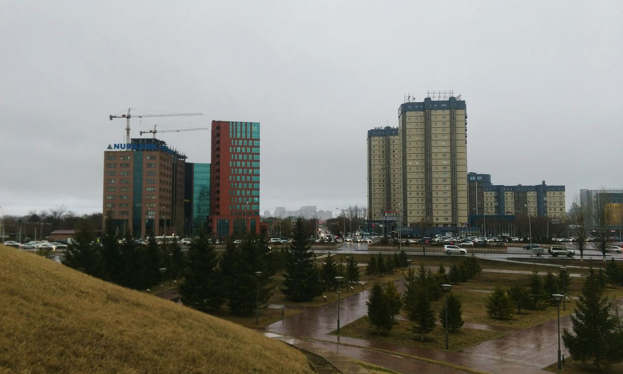 building exterior, architecture, built structure, city, clear sky, skyscraper, sky, crane - construction machinery, building, development, tall - high, cityscape, tower, urban skyline, copy space, construction site, office building, modern, no people, outdoors