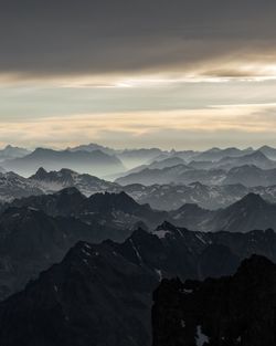 Scenic view of mountains against sky during sunset