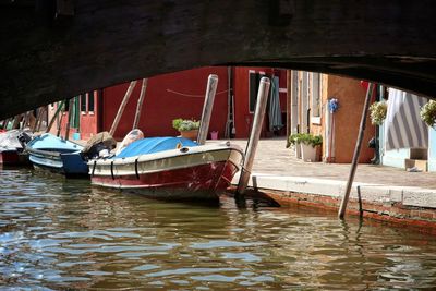 Boats moored in water