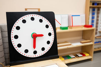 Close-up of clock on table