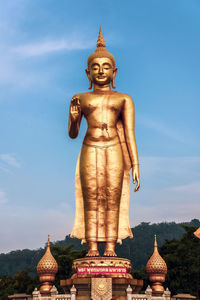 Statue of temple against building