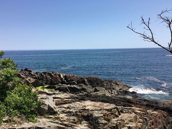 Scenic view of sea against clear blue sky