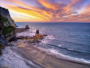 View of the beach of portizuelo in luarca, asturias, spain at sunset.