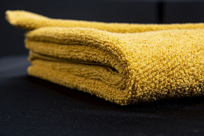 Close-up of yellow fabric on table