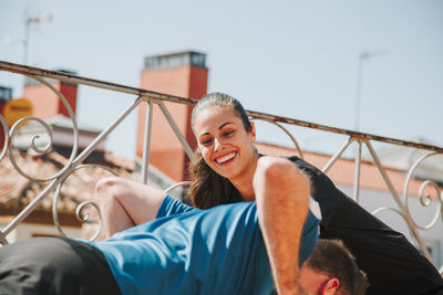 A couple exercising on their rooftop