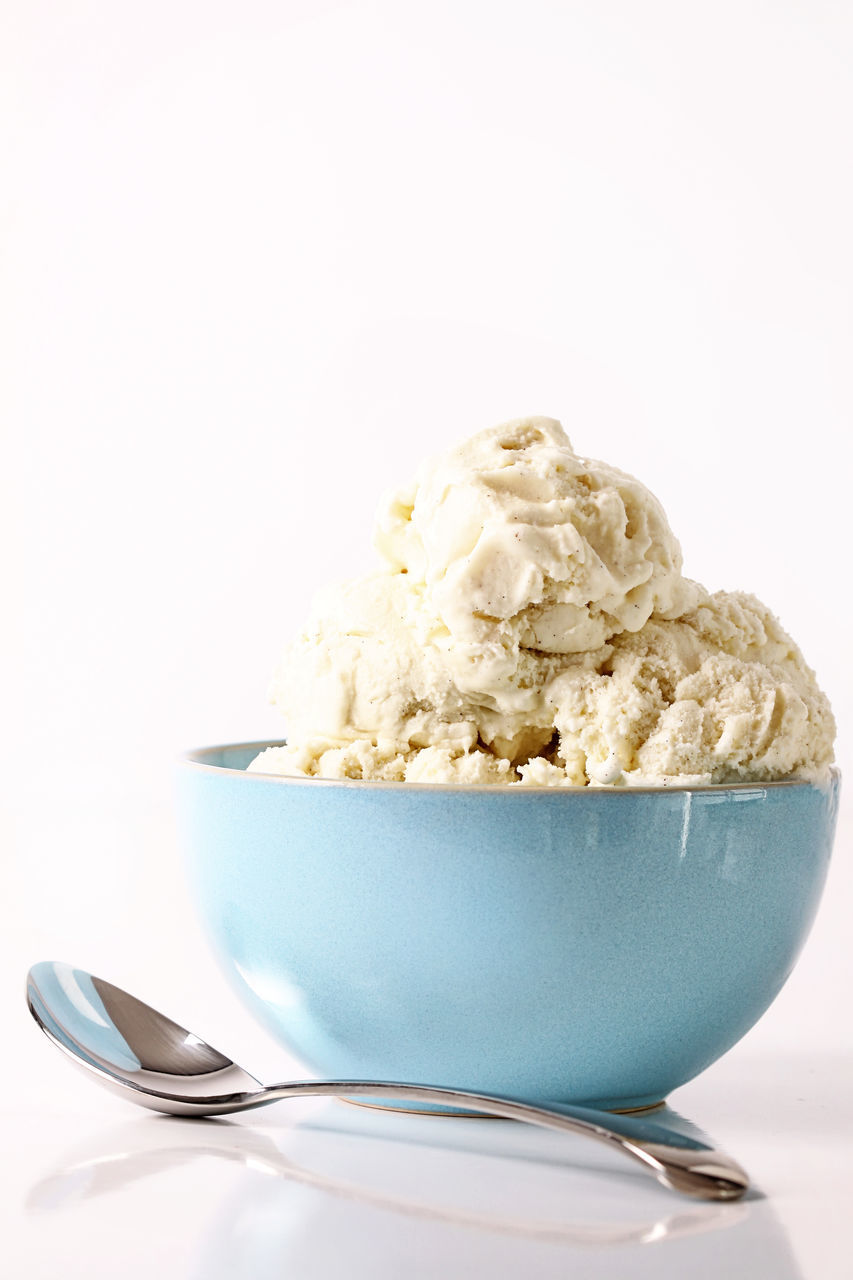 food and drink, food, ice cream, kitchen utensil, dessert, dairy, sweet food, eating utensil, frozen food, bowl, sweet, frozen, spoon, studio shot, vanilla, vanilla ice cream, dish, indoors, breakfast, healthy eating, white background, produce, freshness, no people, scoop shape