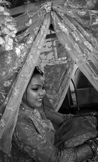 Portrait of a smiling young woman in water