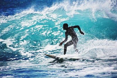 People surfing in sea