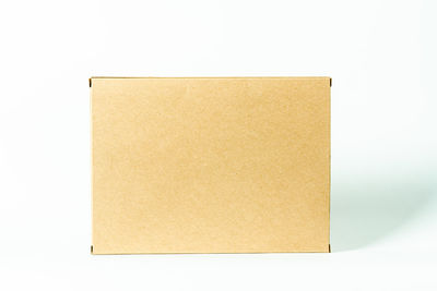 Close-up of yellow paper against white background