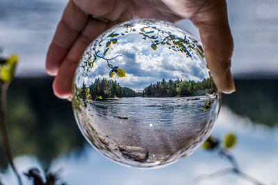 Close-up of hand holding glass of water