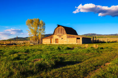 House on field against sky