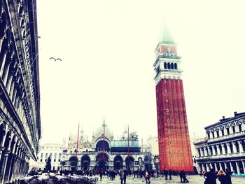 Silhouette of people against clear sky