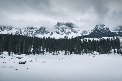 Scenic view of snow covered mountains against sky