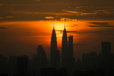 Silhouette of city at sunset