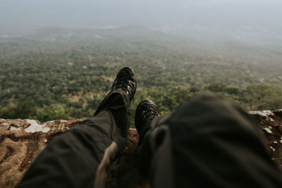 Low section of people relaxing on mountain