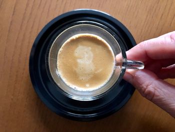 High angle view of coffee cup on table